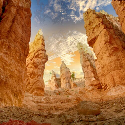 Breathtaking view of towering sandstone formations under a dramatic sky, showcasing natural erosion.